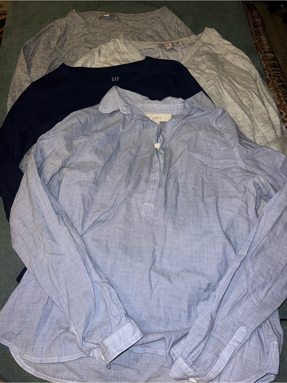 Bundle of four size small long-sleeved tops